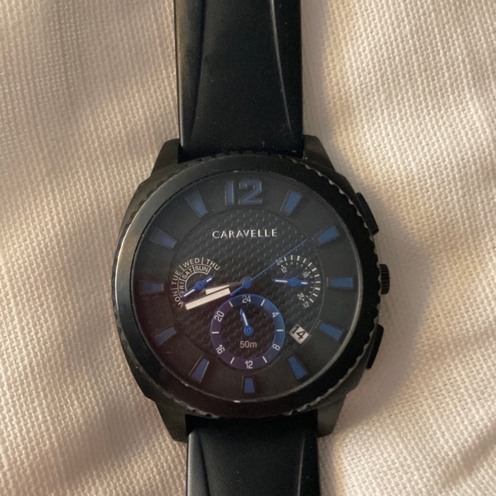 Men’s Caravelle watch style 45B159. Used in good condition. Silicone band